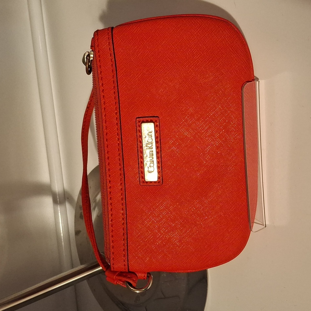 NWOT Calvin Klein Coral Colored wristlet